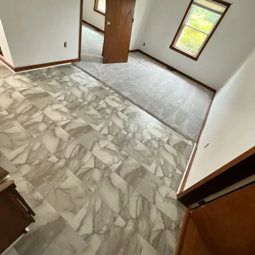 Triangle Flooring - Kitchen tile floor installation with transition to carpet